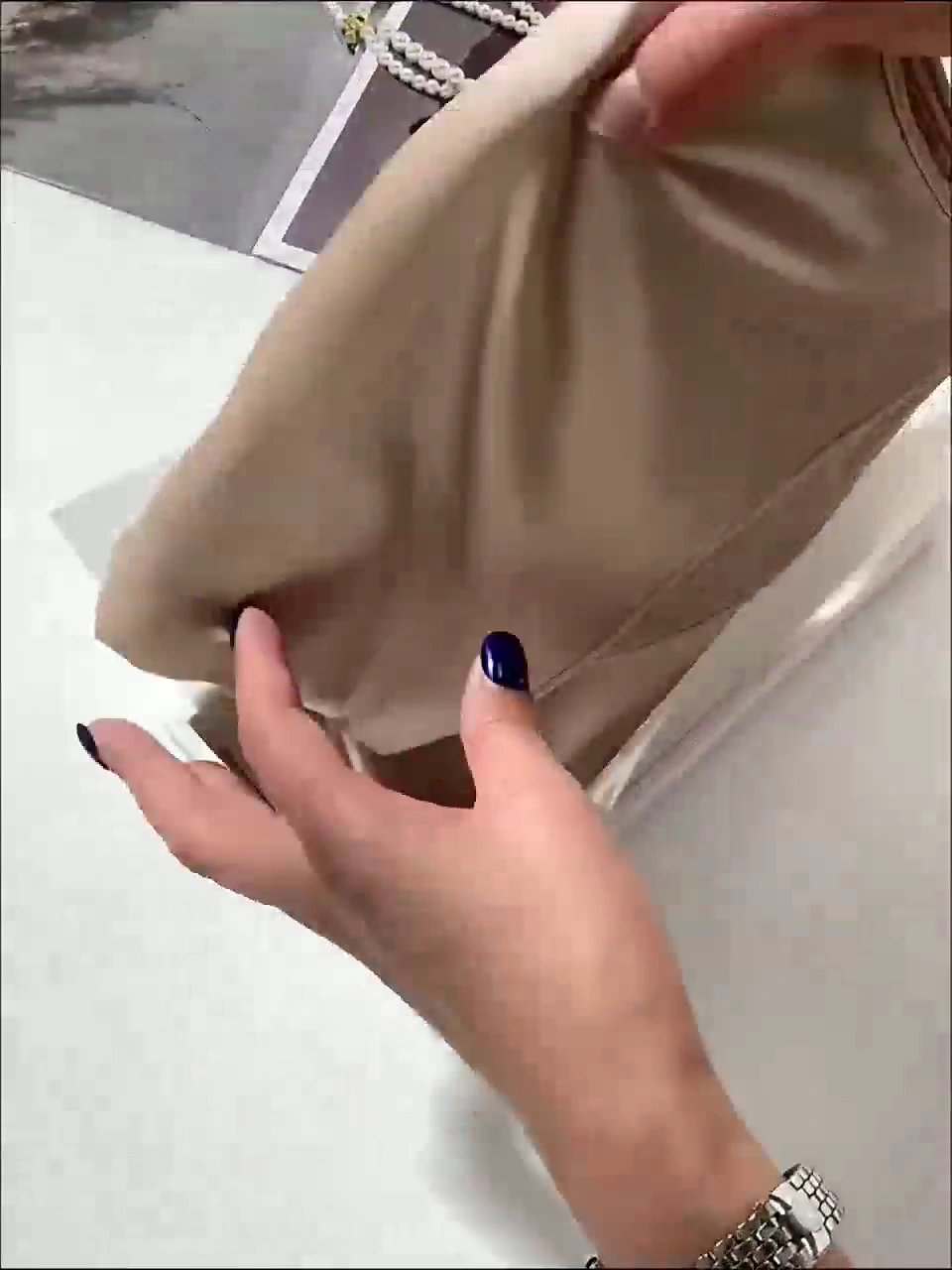 Real ivory silk pillowcase sample shown in hand