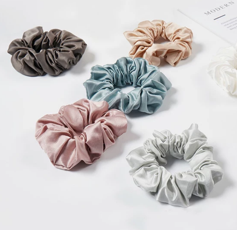 Curated color set of silk scrunchies in black, blue, blush, ivory and champagne